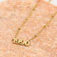 Ketting jaartal 1990 goudkleurig