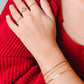 schakelarmband triple goudkleurig