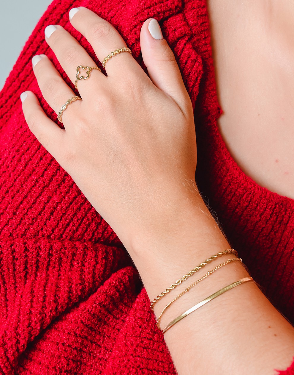 schakelarmband triple goudkleurig