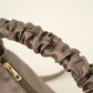 Trendy hand of crossbody tasje brons