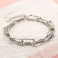 double silver-colored link bracelet