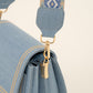 Trendy lichte jeans tas met bewerkte strap