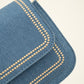 Trendy jeans tas met bewerkte strap