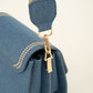 Trendy jeans tas met bewerkte strap