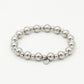silver-colored ball bracelet