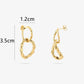 gold-colored link earrings 