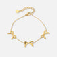 minimalist bracelet with 3 gold-colored bows