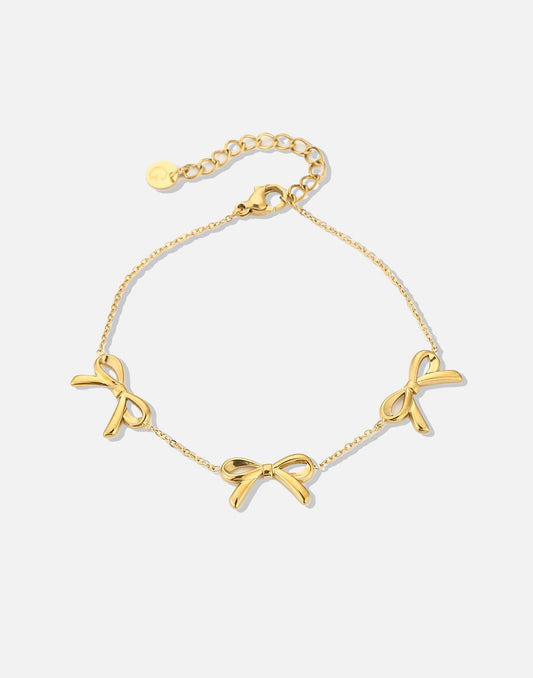 minimalistische armband met 3 strikjes goudkleurig