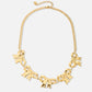 schakelketting met 5 chunky strikjes goudkleurig