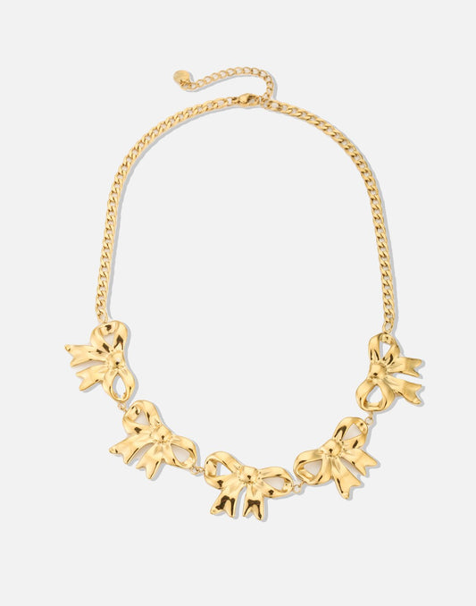 schakelketting met 5 chunky strikjes goudkleurig