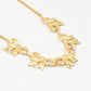 schakelketting met 5 chunky strikjes goudkleurig