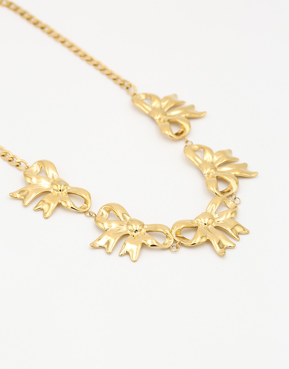 schakelketting met 5 chunky strikjes goudkleurig