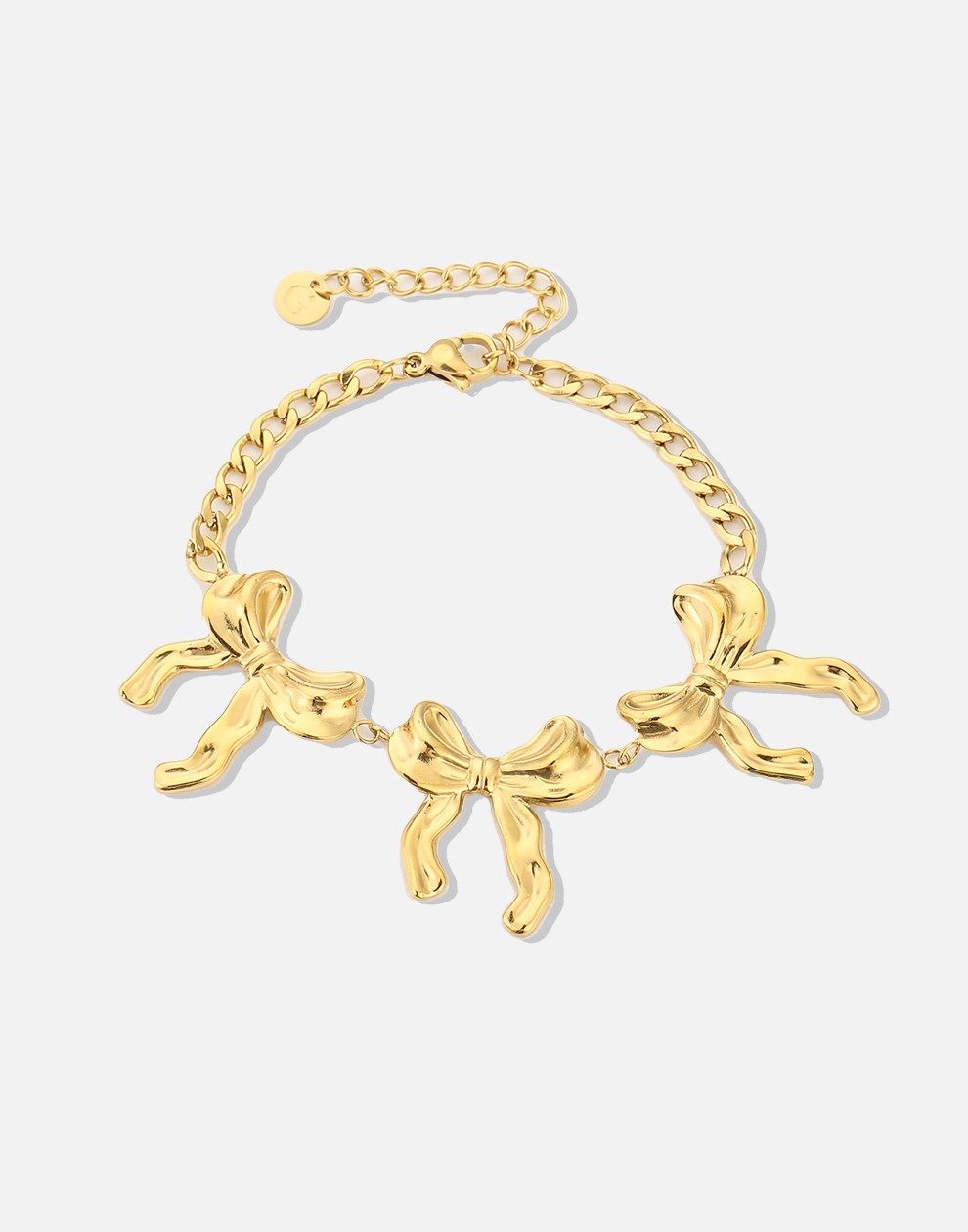 schakelarmband met 3 chunky strikjes goudkleurig