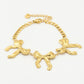 schakelarmband met 3 chunky strikjes goudkleurig