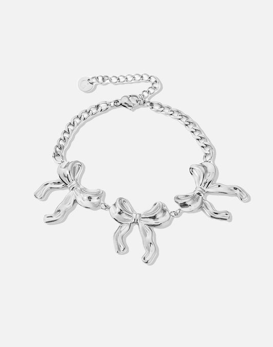 schakelarmband met 3 chunky strikjes zilverkleurig