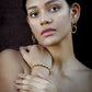 gold-colored link earrings 