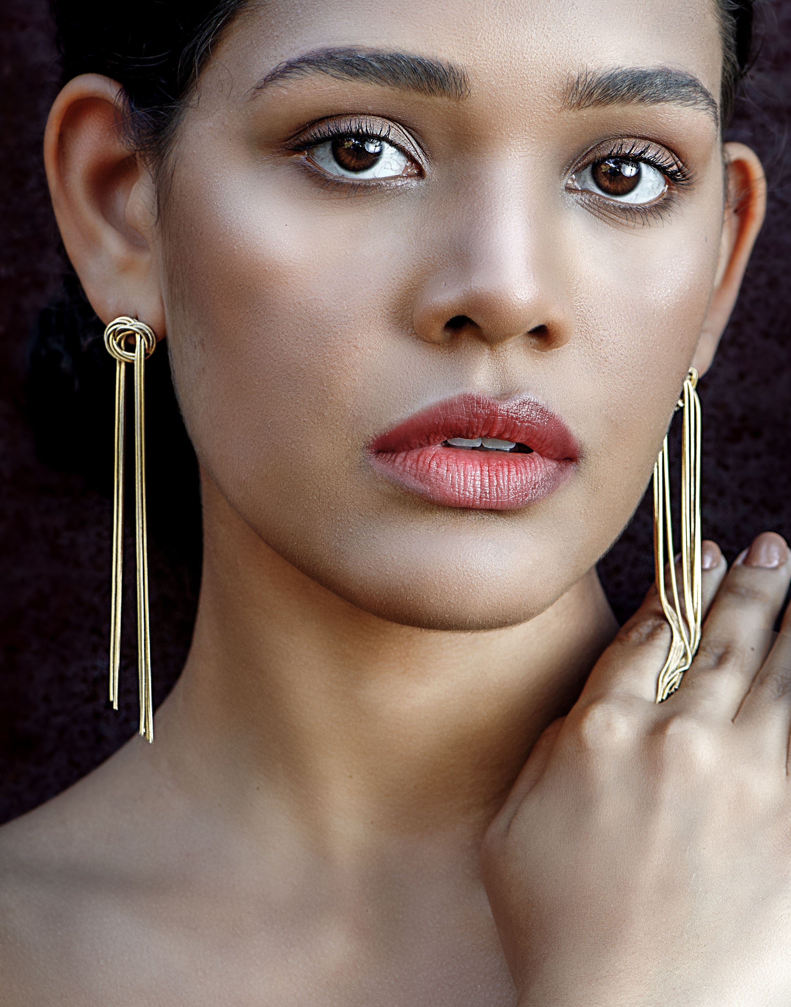 knot earrings with gold-colored strings