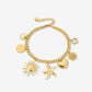 Charm bracelet links with different charms gold-colored
