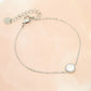 Bracelet coin with silver-colored heart