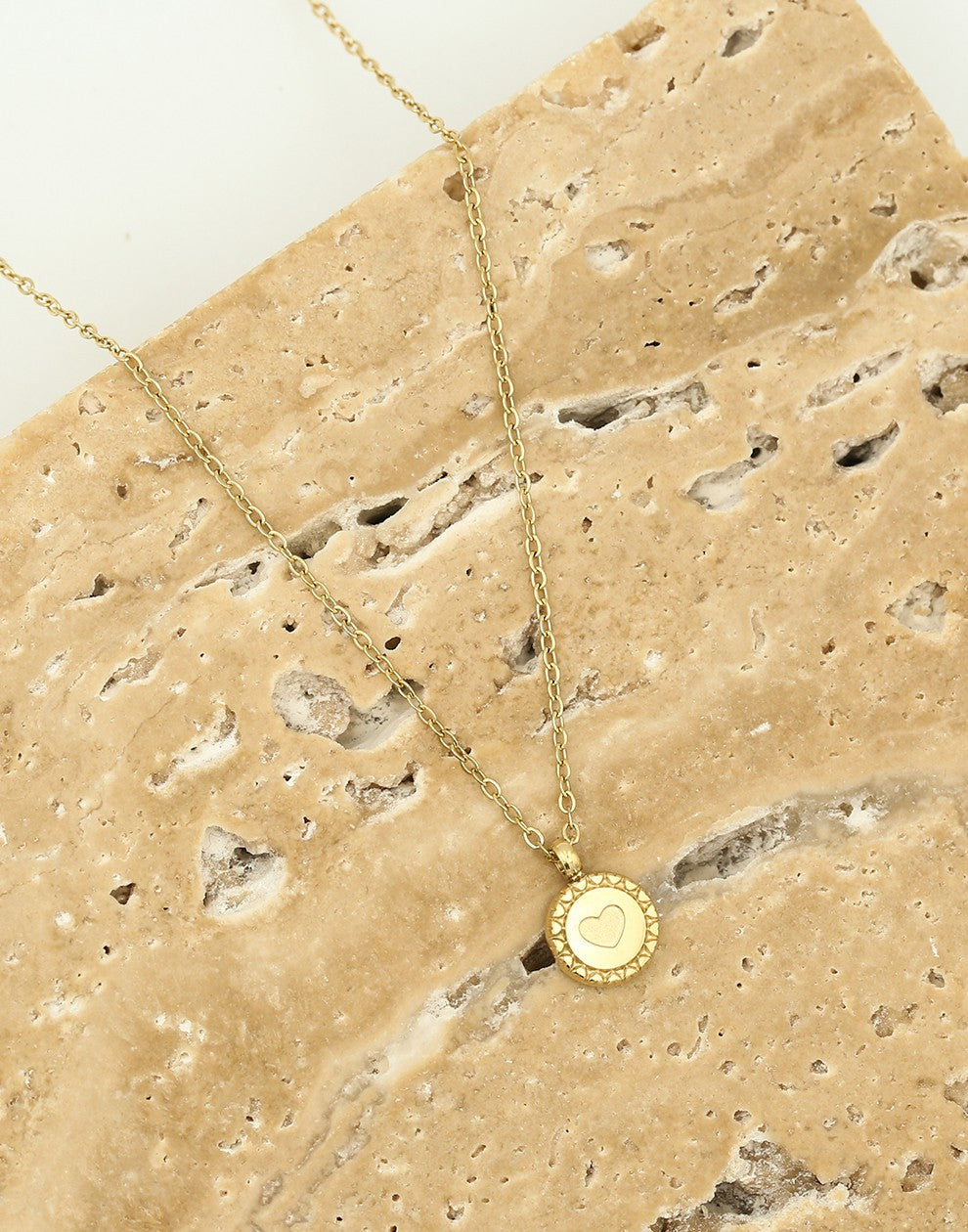 Ketting munt met hartje goudkleurig