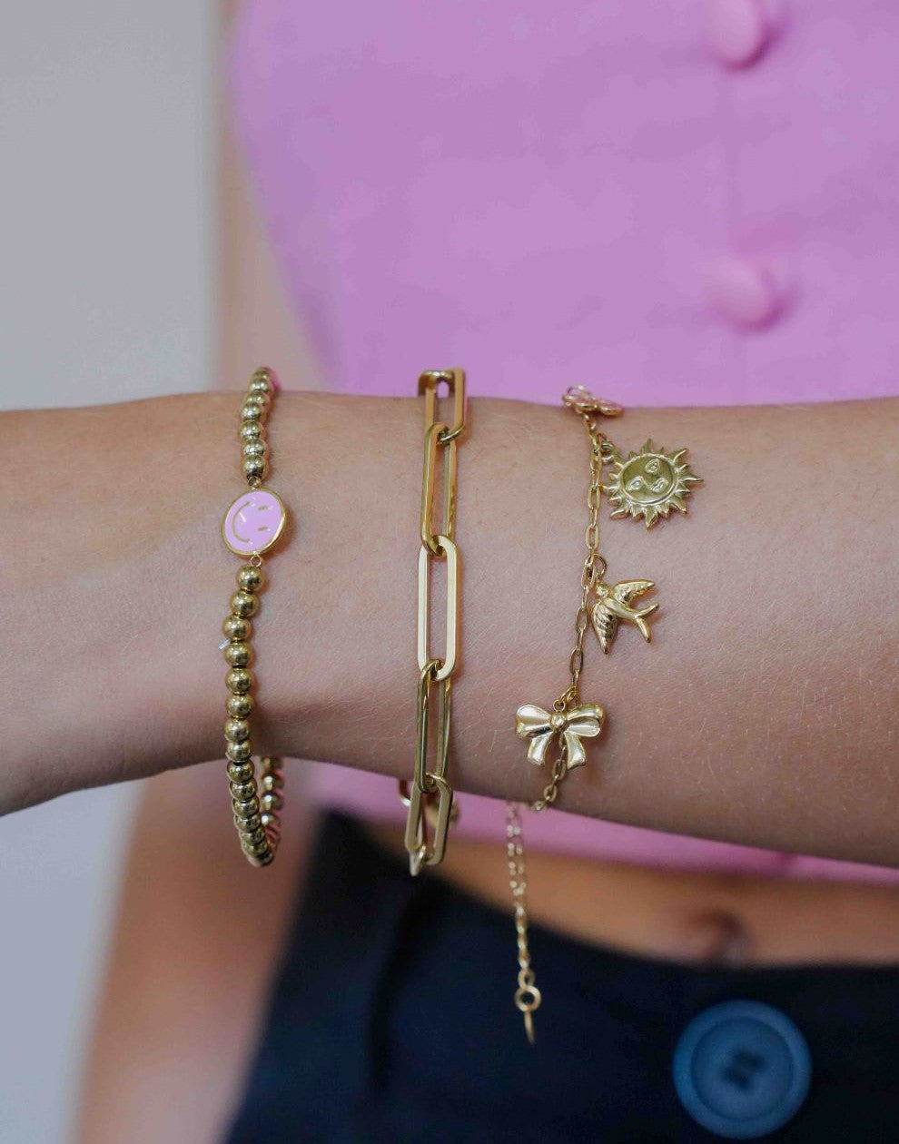 stretch armband smiley roze