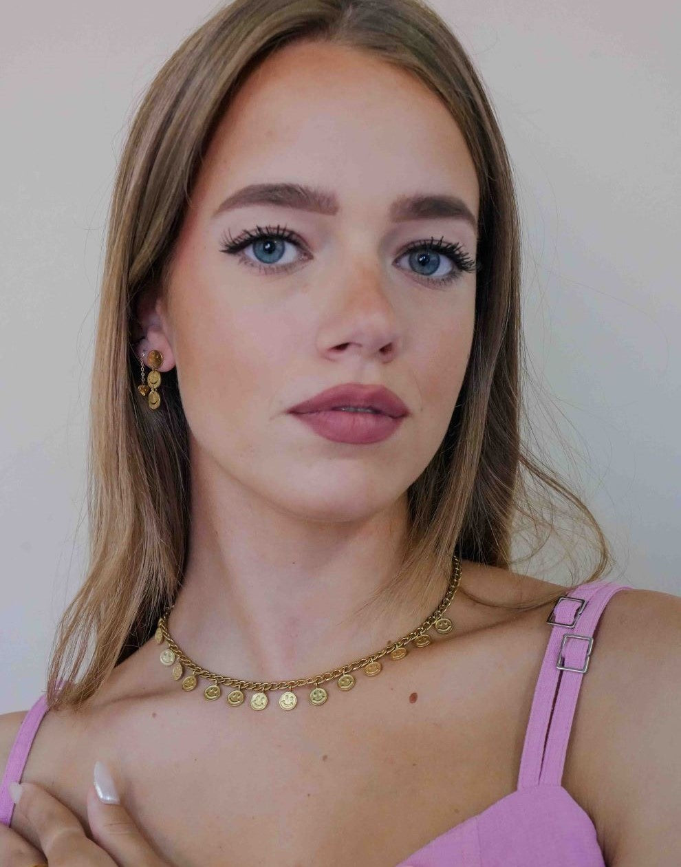 schakelketting met smiley muntjes goudkleurig
