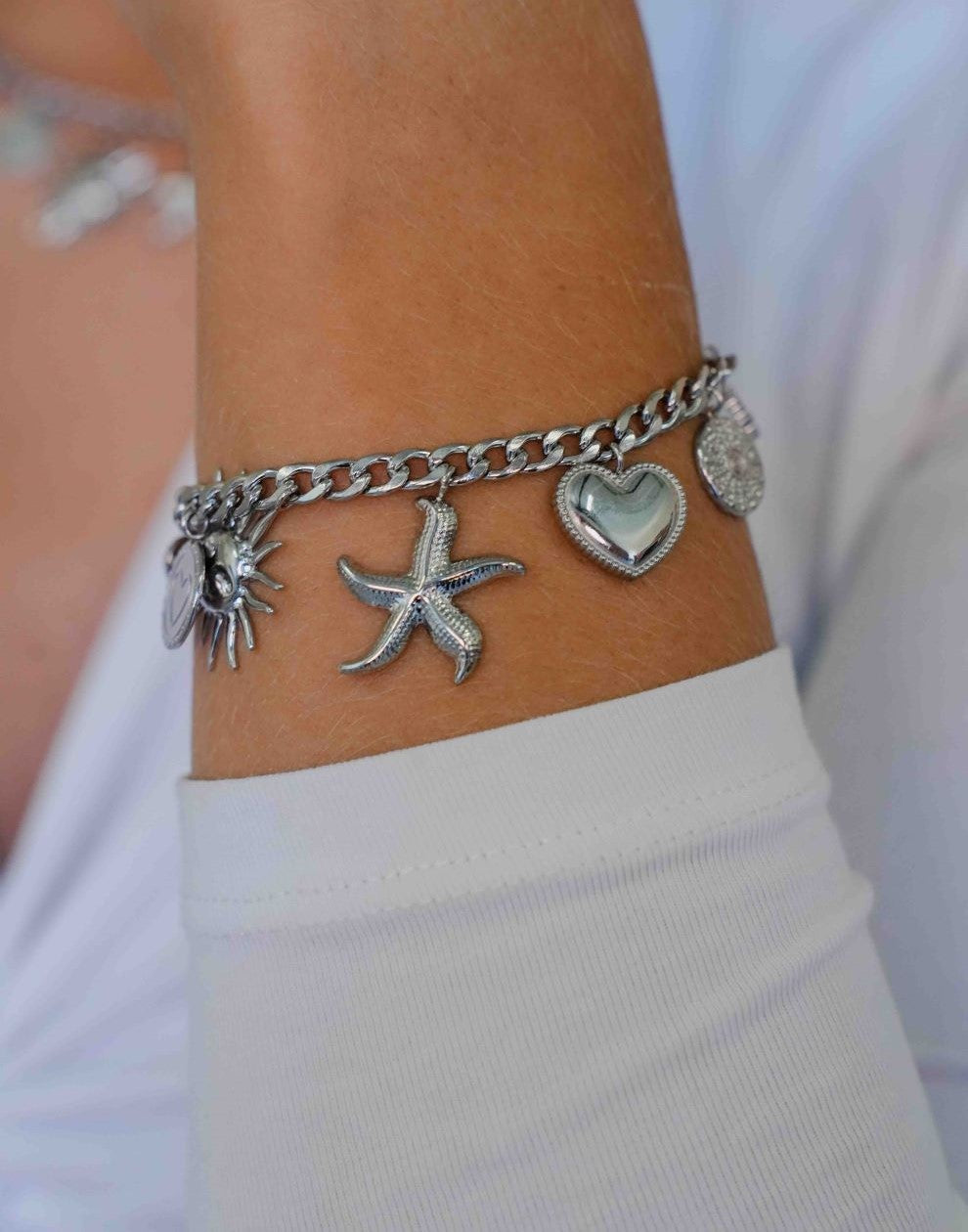 Bedel armband schakels met verschillende bedels zilverkleurig