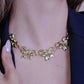 schakelketting met 5 chunky strikjes goudkleurig