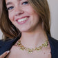 schakelketting met 5 chunky strikjes goudkleurig