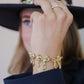 schakelarmband met 3 chunky strikjes goudkleurig