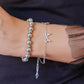 silver-colored ball bracelet