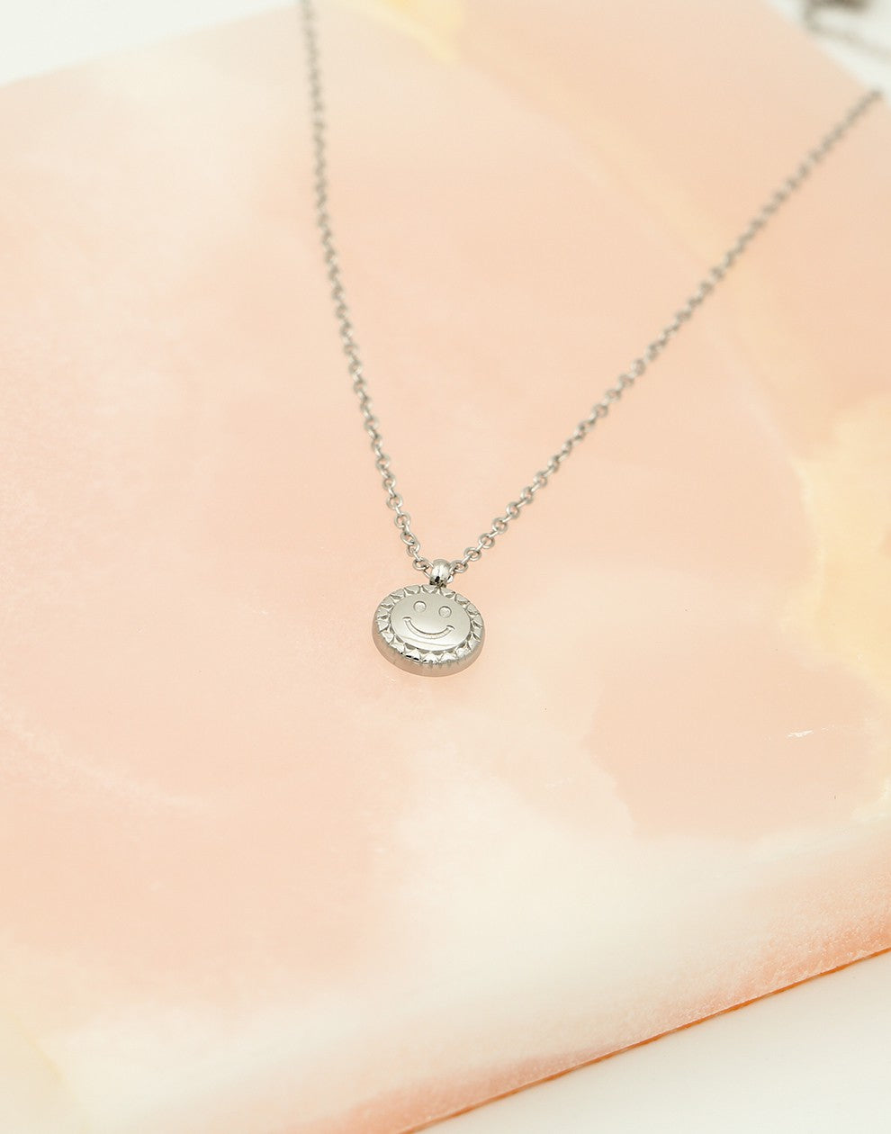 Ketting munt met smiley zilverkleurig