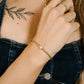 stretch armband kruisje goudkleurig