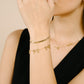 minimalist bracelet with 3 gold-colored bows