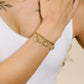 Charm bracelet links with different charms gold-colored
