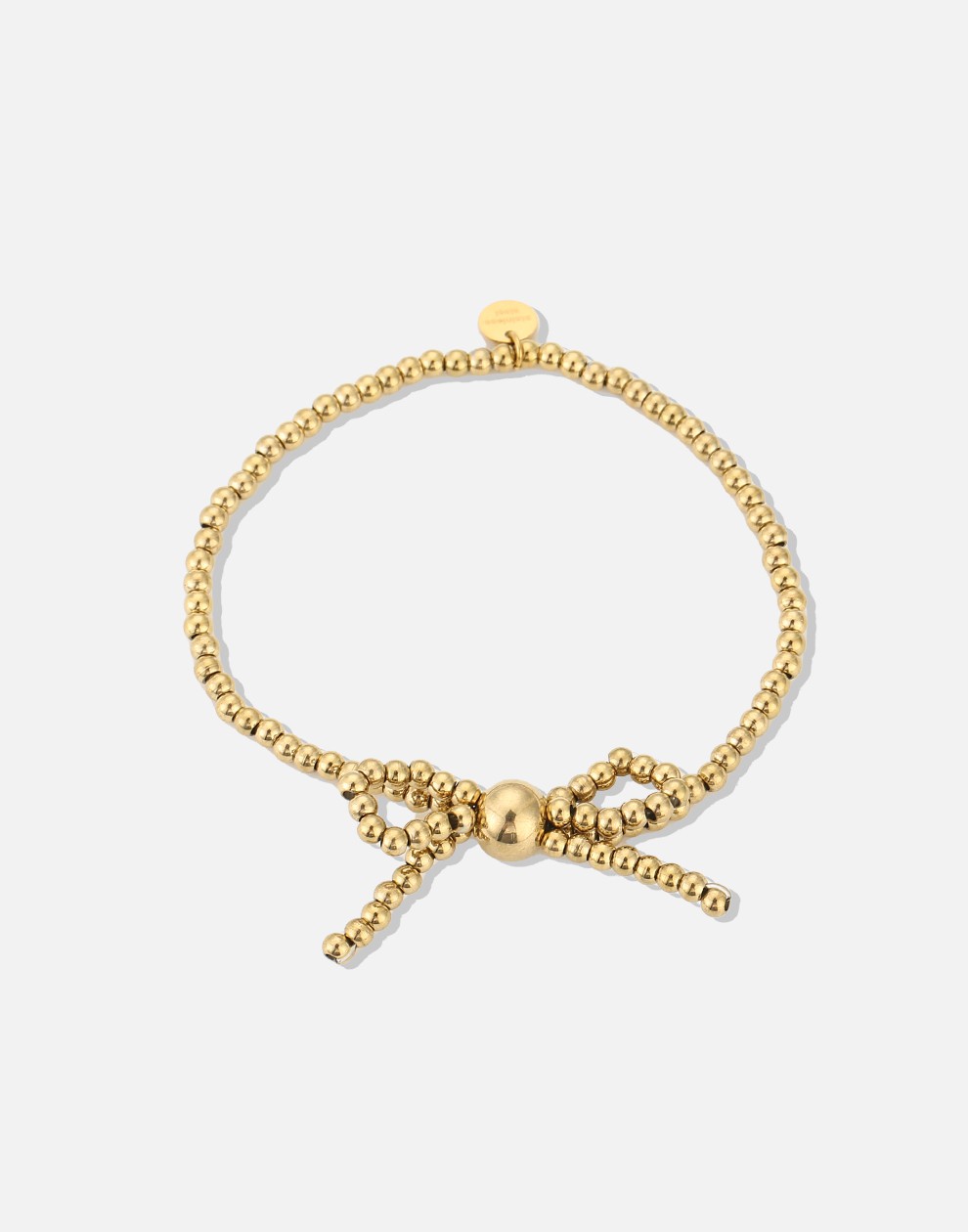 Stretch armband bolletjes strik goudkleurig
