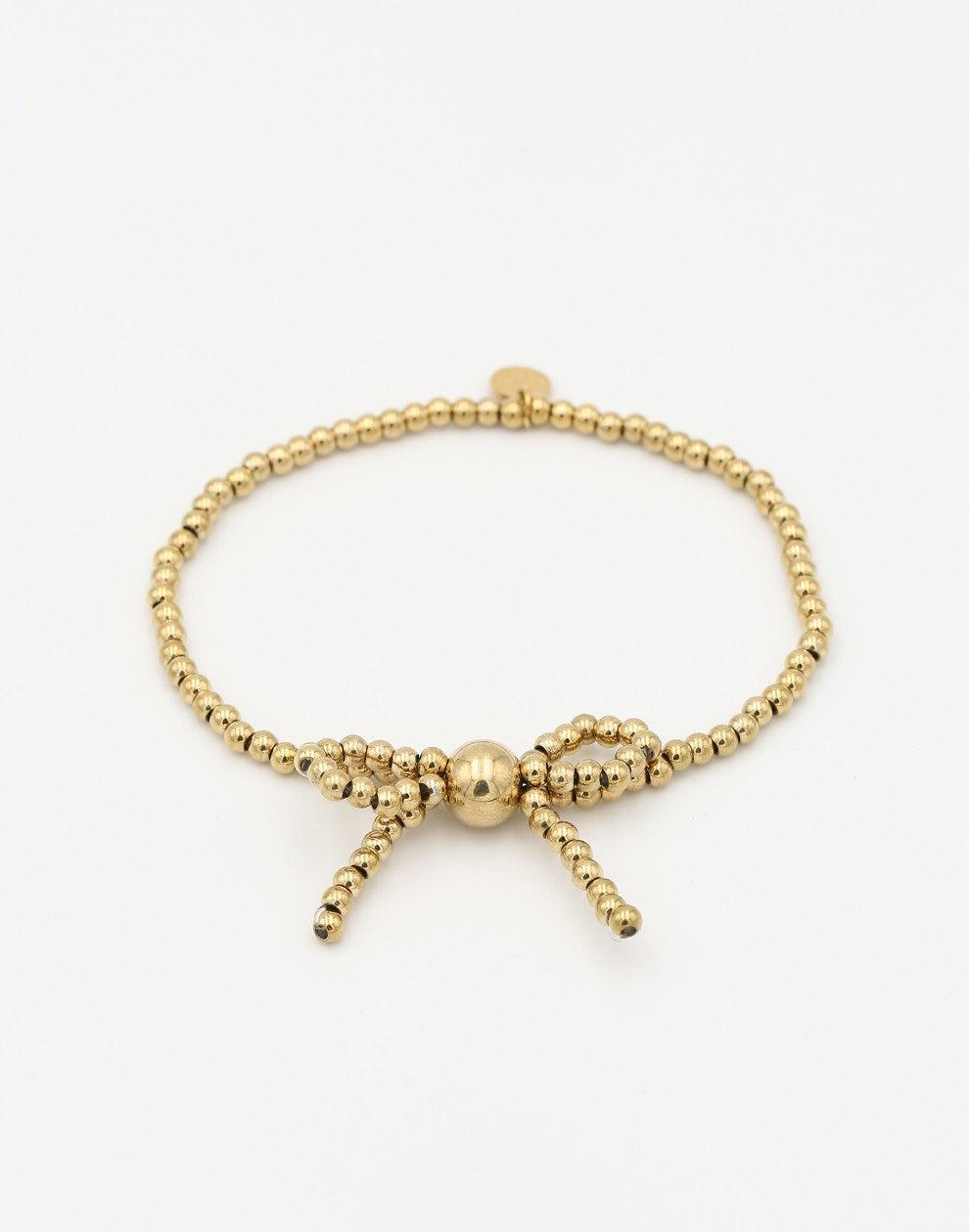 Stretch armband bolletjes strik goudkleurig