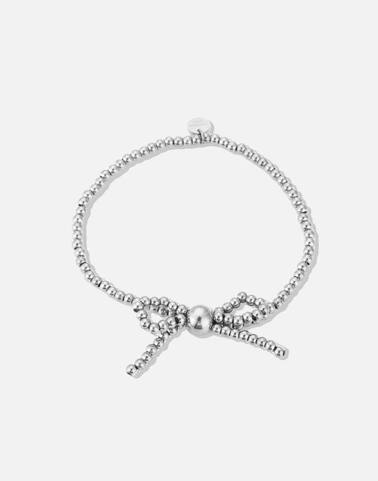 Stretch armband bolletjes strik zilverkleurig