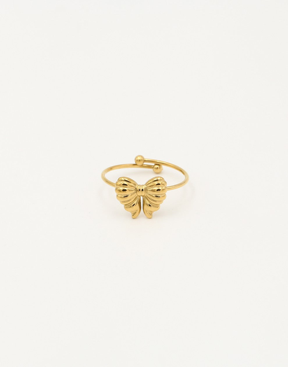 Gold-colored ring with bow