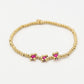 Stretch armband bolletjes bloemen fuchsia