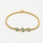 stretch armband bolletjes bloemen turquoise