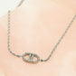 Gedraaide schakelketting met symbool strass zilverkleurig