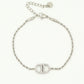Gedraaide schakelarmband met symbool strass zilverkleurig