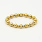 statement armband bollen goudkleurig