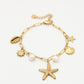 Bedelarmband zeester goudkleurig