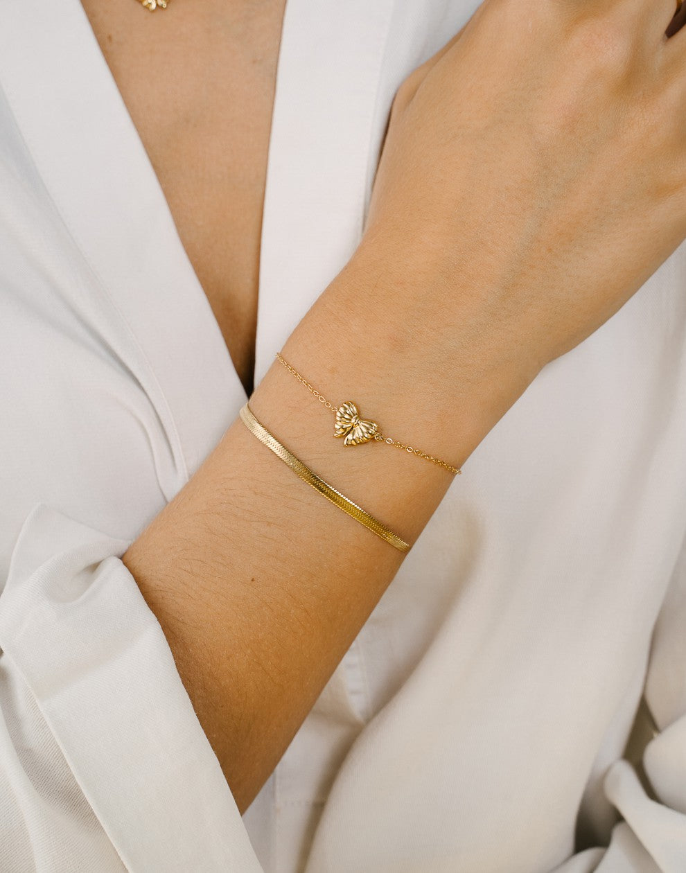 armband strikje goudkleurig