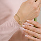 Schakelarmband V goudkleurig