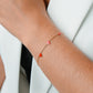 Armband speels hartjes rood goudkleurig