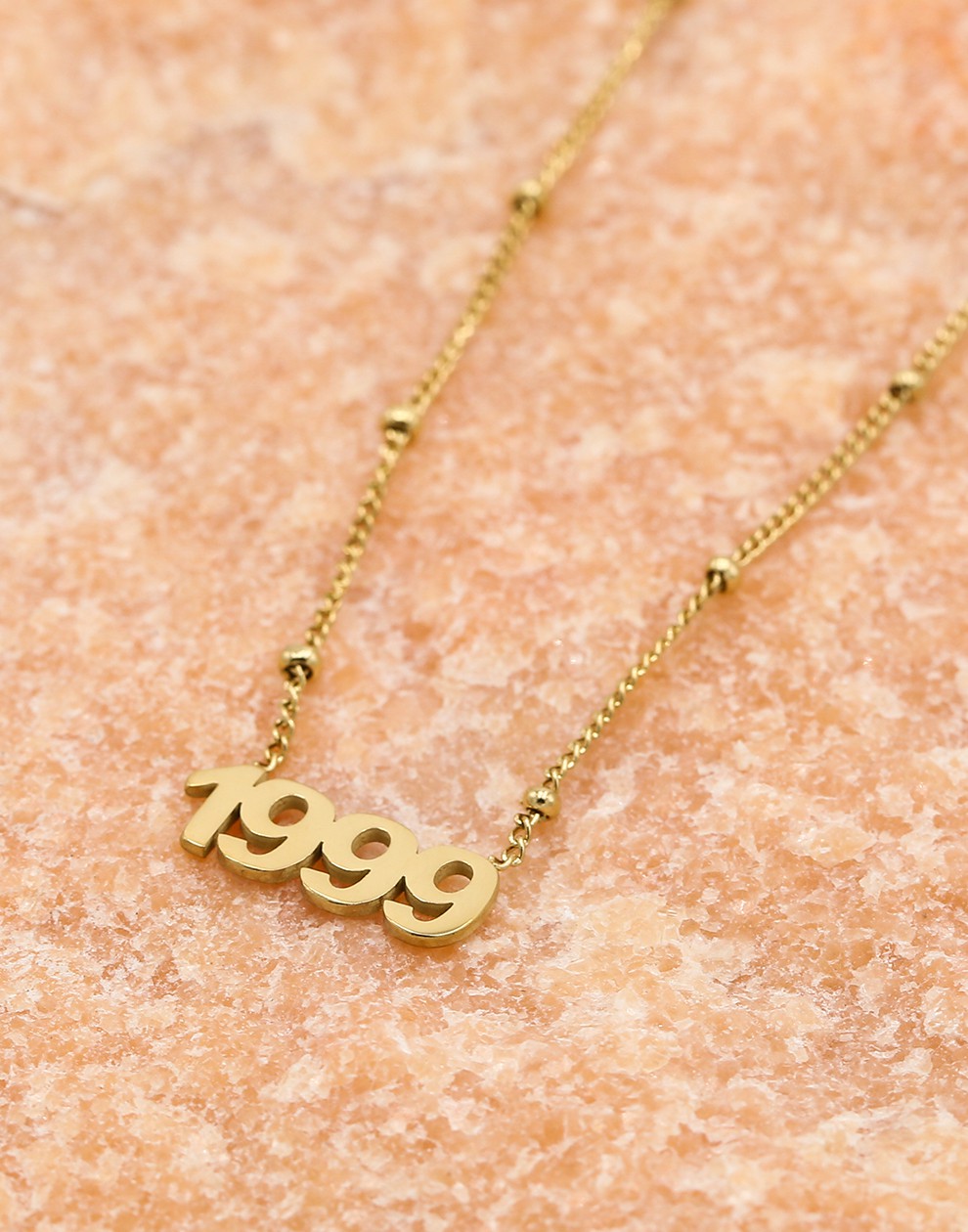 Ketting jaartal 1999 goudkleurig
