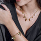Bedelketting bloemen en hartjes goudkleurig